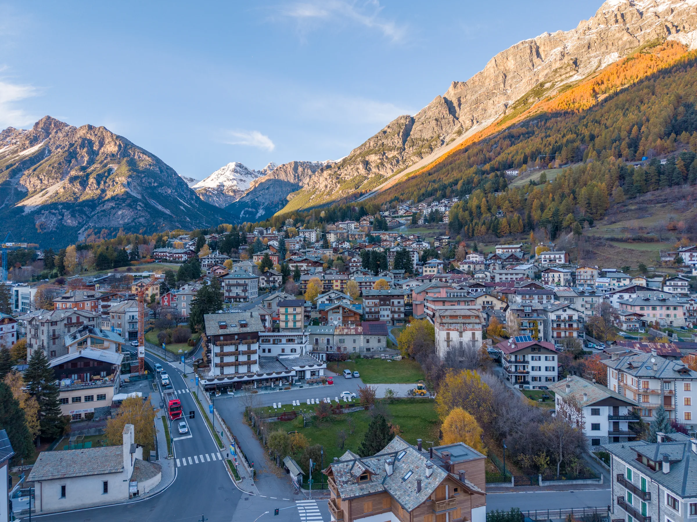 Alpine village and mountain landscape from above — Bormio & Valtellina, Italy. Photography by Yunes Calore.
