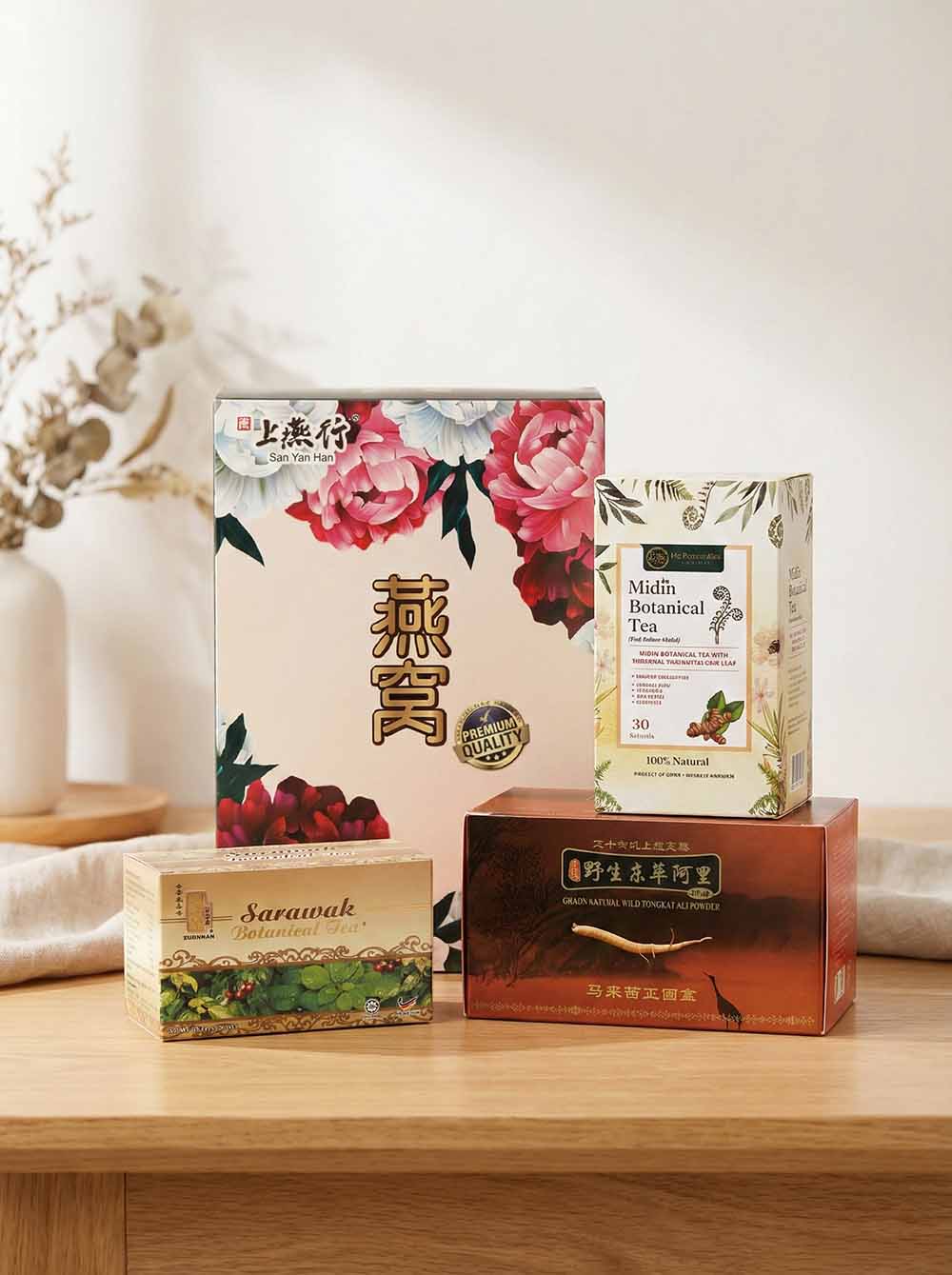 Custom printed folding cartons manufactured in Kuching, Sarawak, featuring Midin Botanical Tea and premium Bird's Nest gift boxes with full-color offset printing.