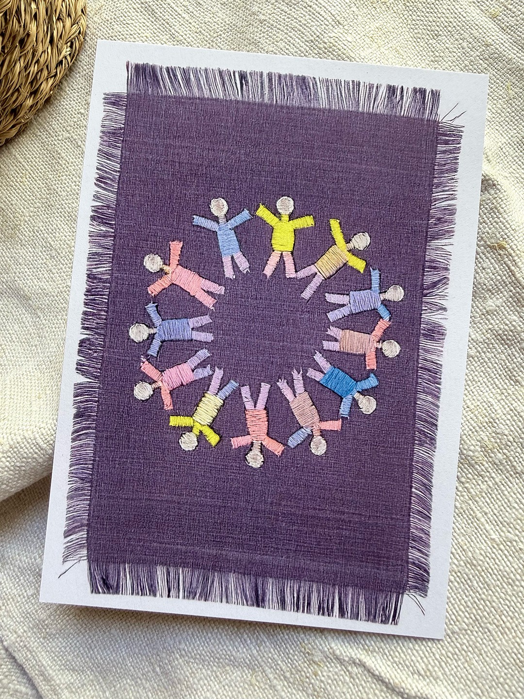 A Card with a embroidered Text