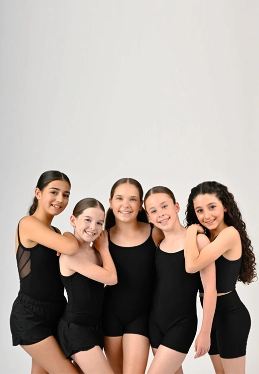 Group of dancers standing arm in arm