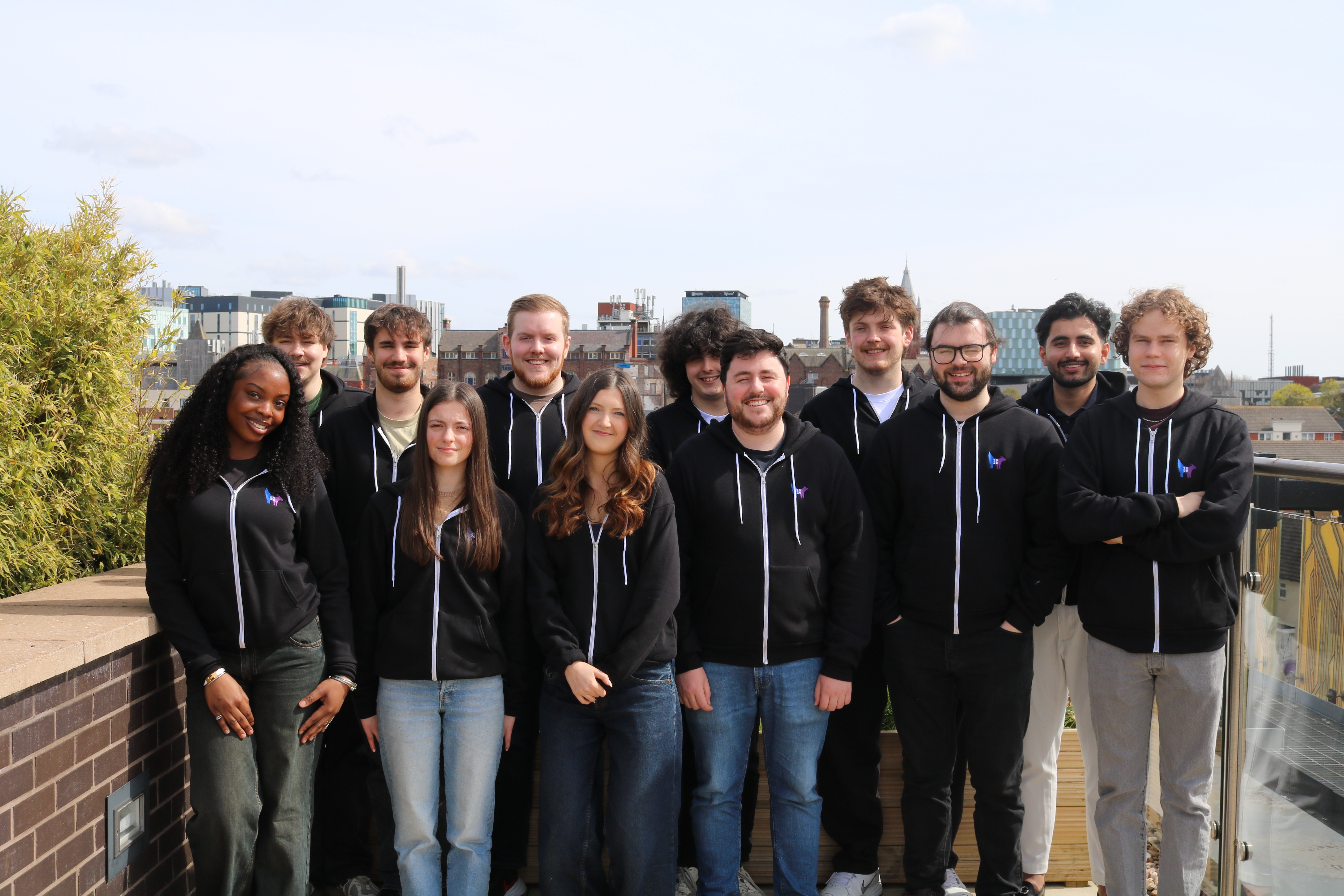 Team picture of Harker and Jamescape staff stood together on the rooftop of CENTRAL TECH.