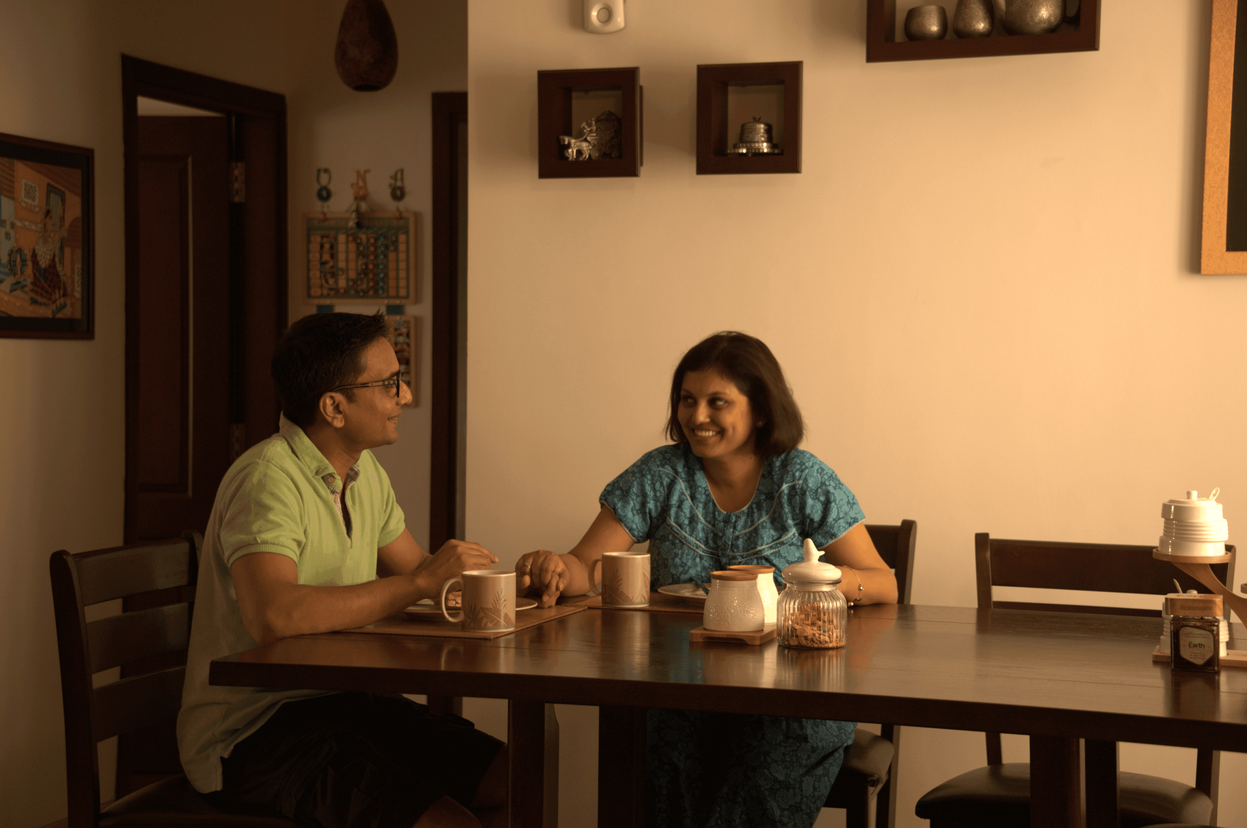 A vibrant bridal bouquet featuring a mix of red, pink, and purple flowers.