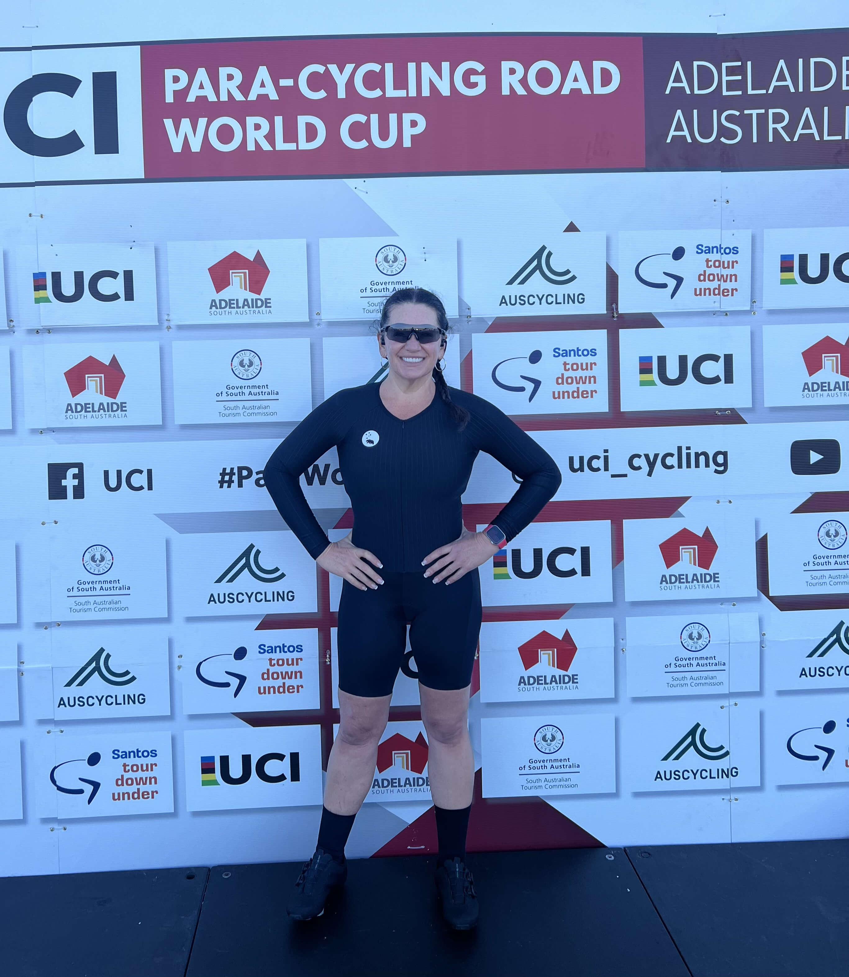 Lily poses on the podium at the Para-cycling world cup in Adelaide pre-race. She wears her black time trial cycling kit.