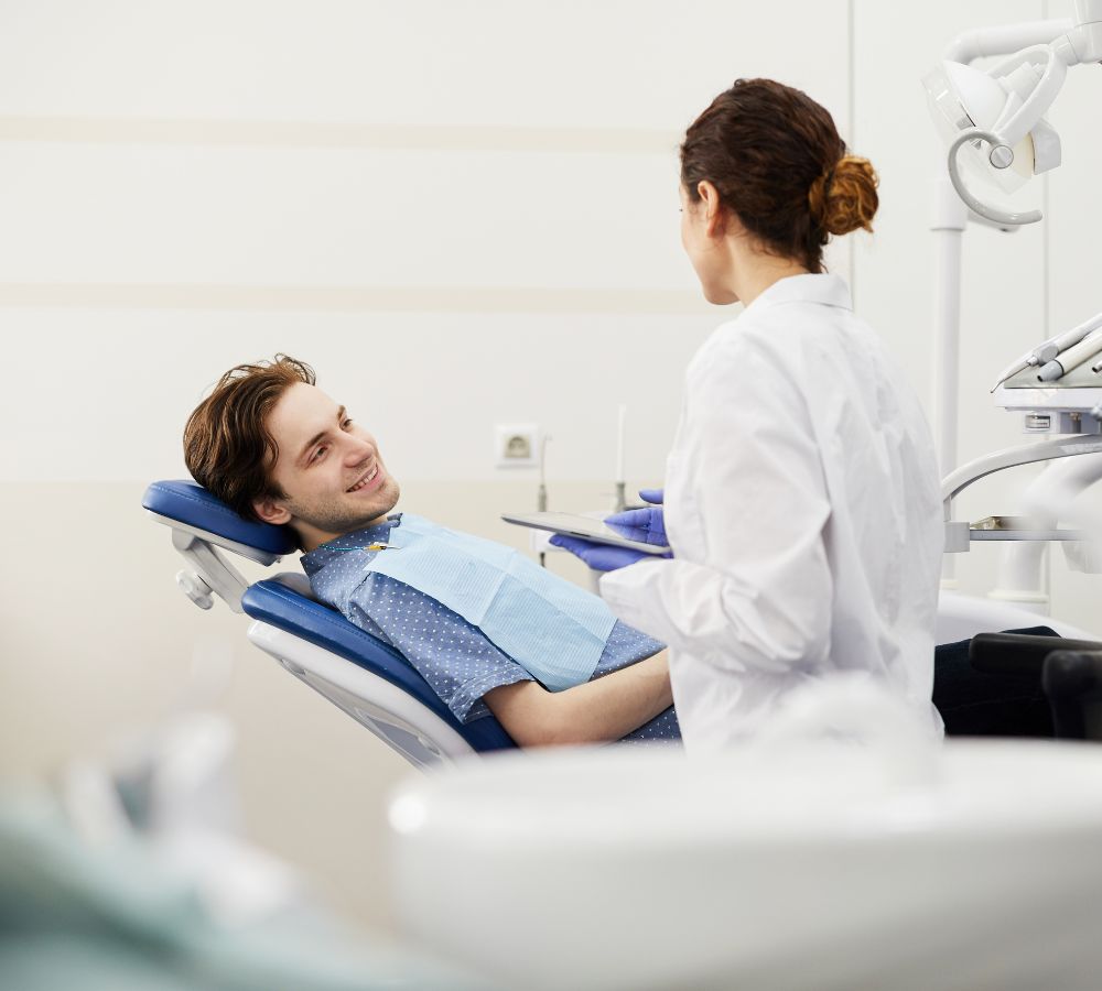 A patient having their teeth examined in the dental chair