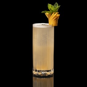 A closeup of a Miami Spritz drink against a dark background.