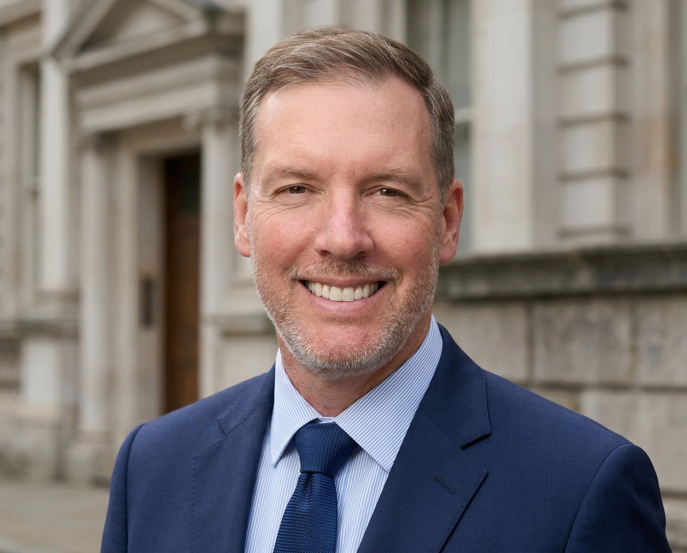 person sitting in a chair in front of a man