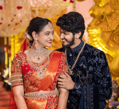 Several glowing blue jellyfish swim in dark water.