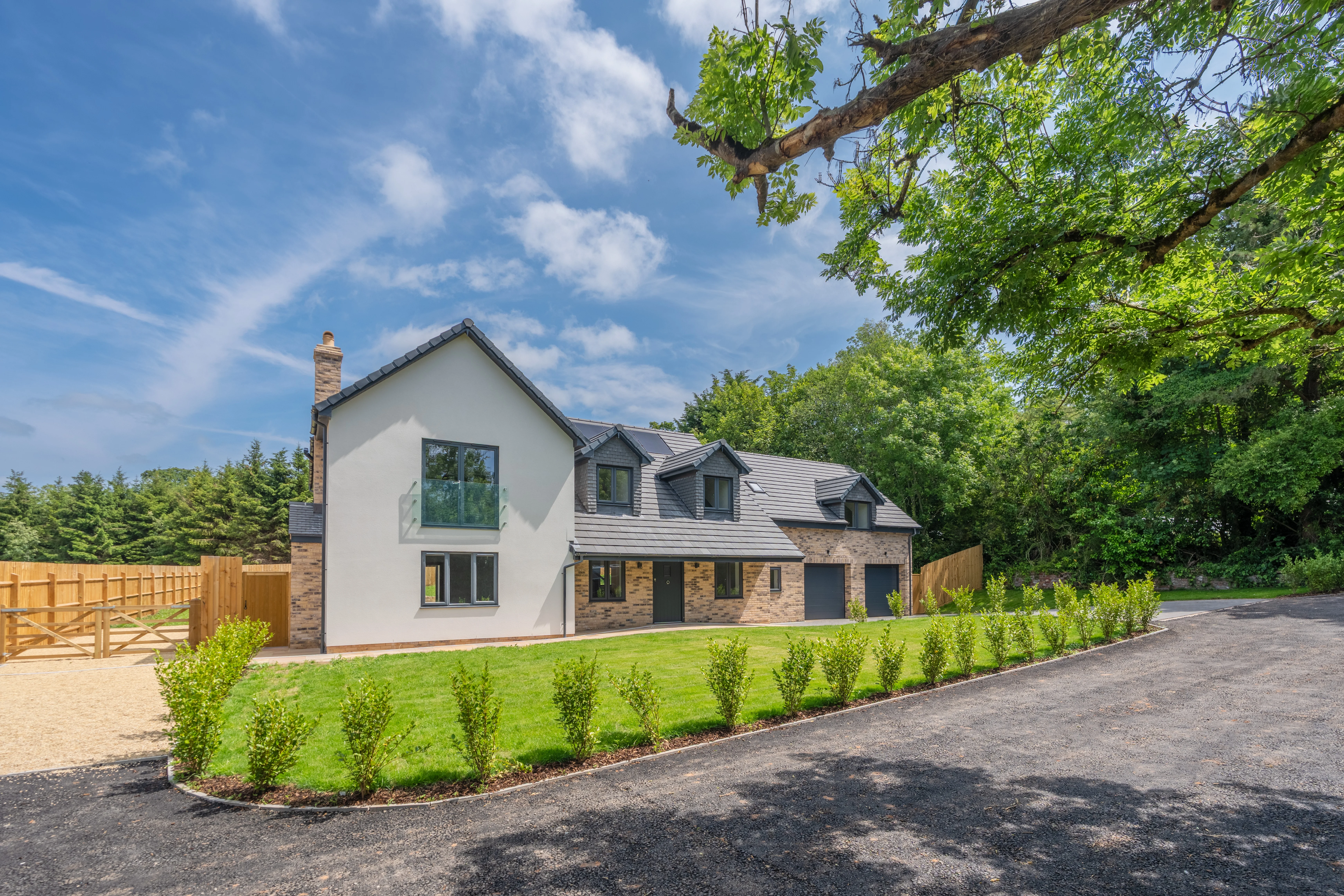 Modern detached family home with landscaped frontage, private driveway, garage and countryside setting