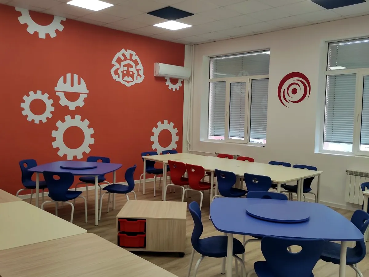 Red and blue stackable school chairs in a classroom project