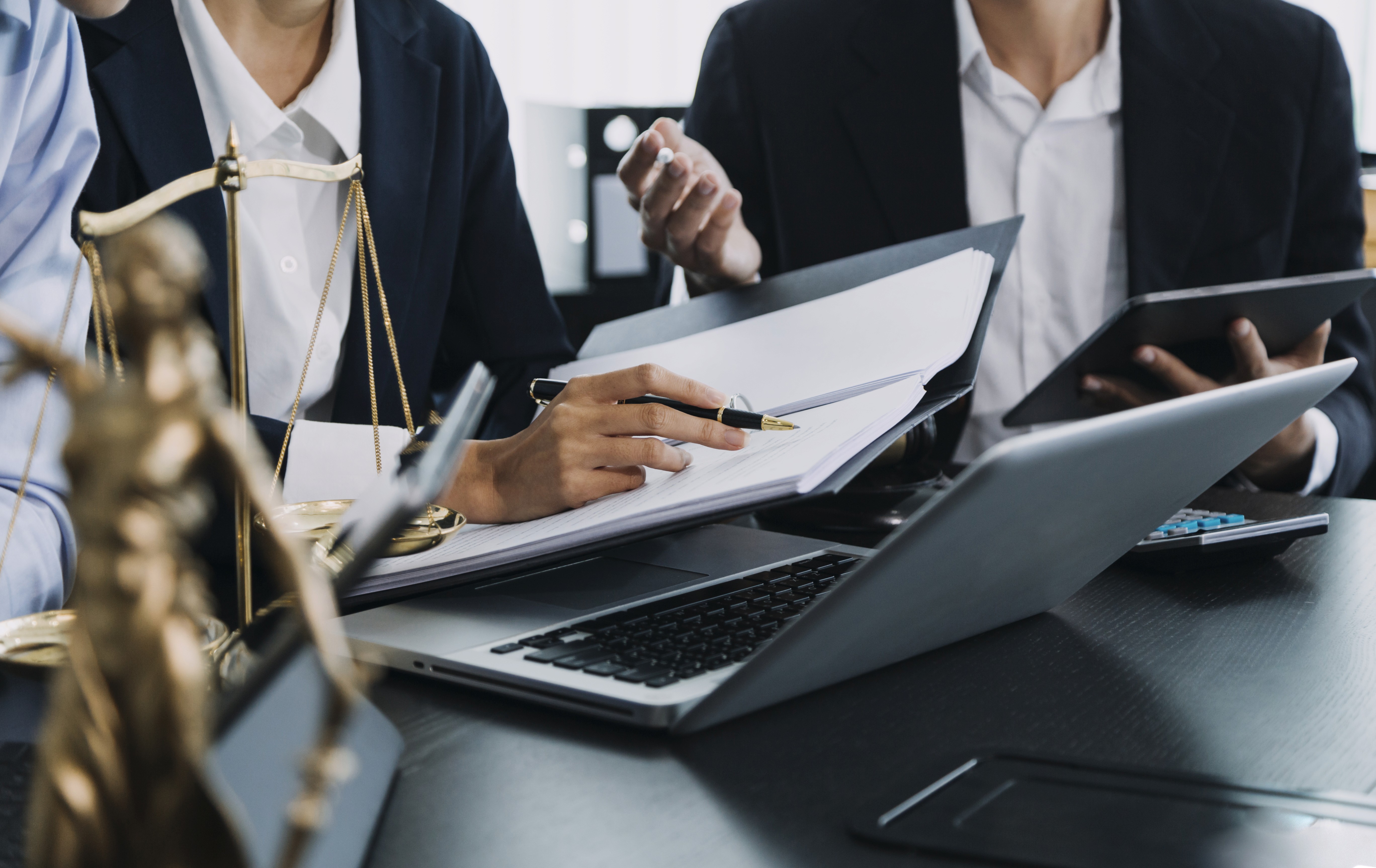 Close up of woman going over finance papers