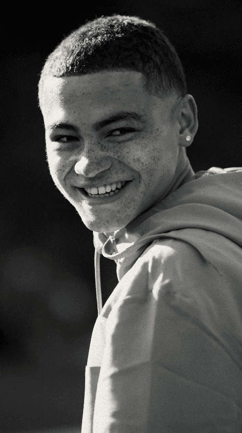 Bride and groom walking on street at night