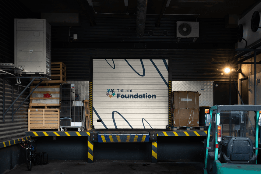 Trillioni Foundation warehouse branding with logo and humanitarian identity design, representing non-profit logistics and community support in Chad.