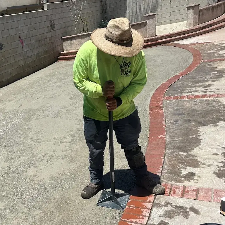 Professional turf installation crew working in Fontana, CA