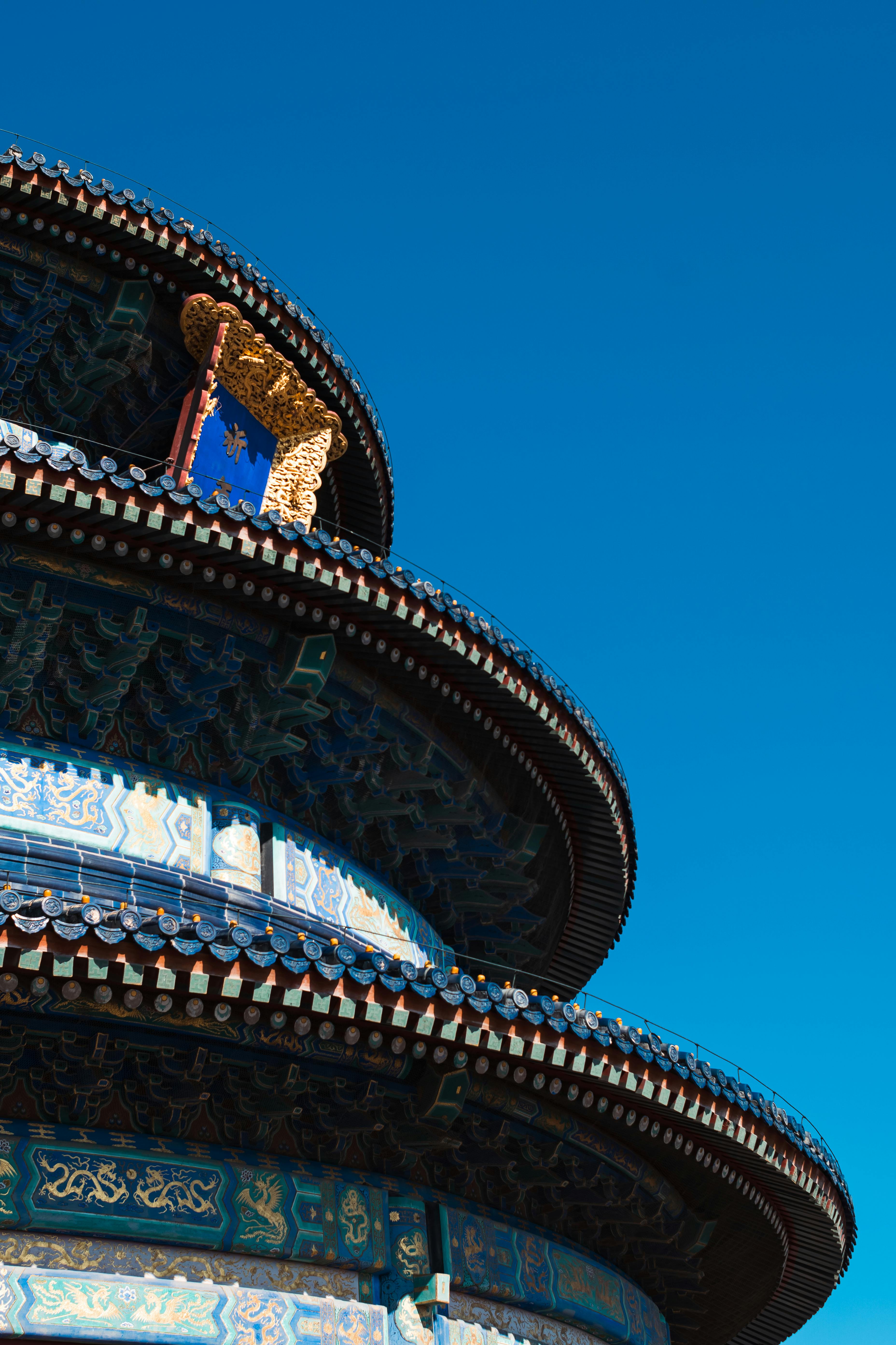 a green field with a mountain in the background