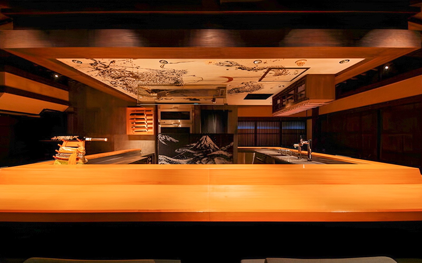 Yakitori chef grilling skewers at Yakitori Tsukiya in Tokyo, showcasing 6/9-course meal preparation.