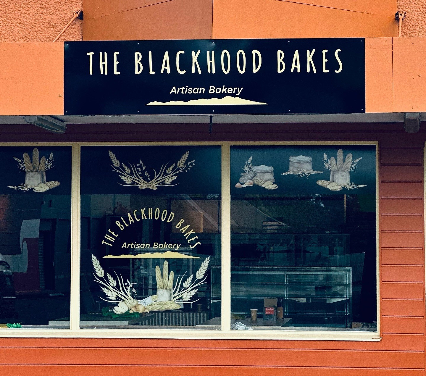 Two chefs behind the kitchen counter