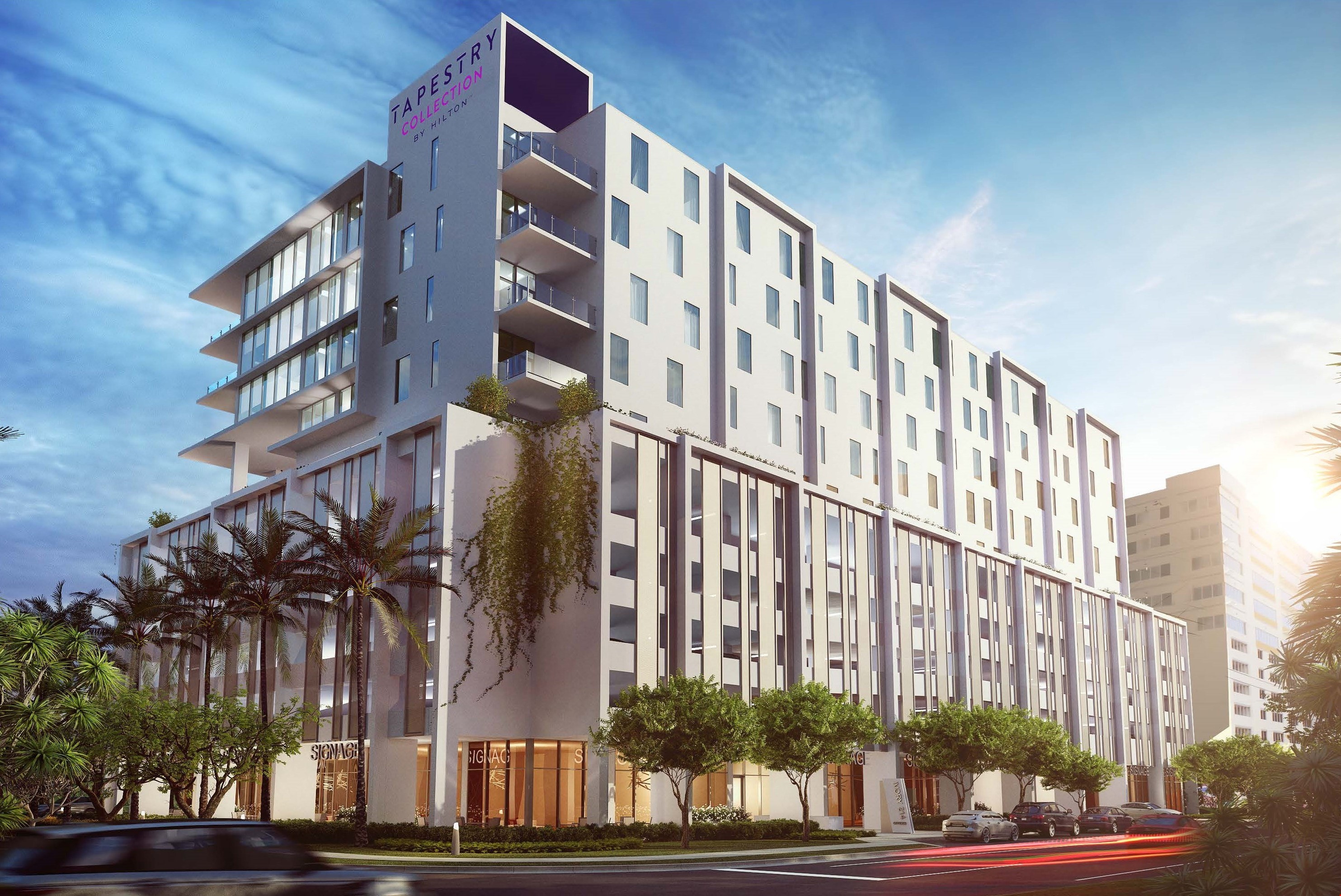 A group of people praticing yoga on the beach in the morning