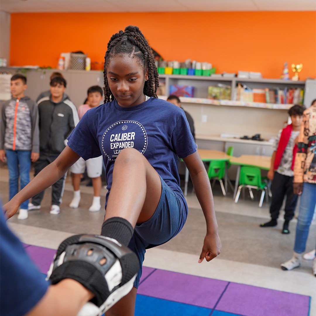 Kids learning grappling fundamentals in elementary school jiu-jitsu enrichment class