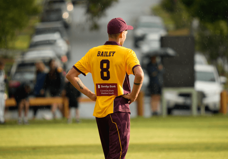 Cricket fielder standing in the outfield