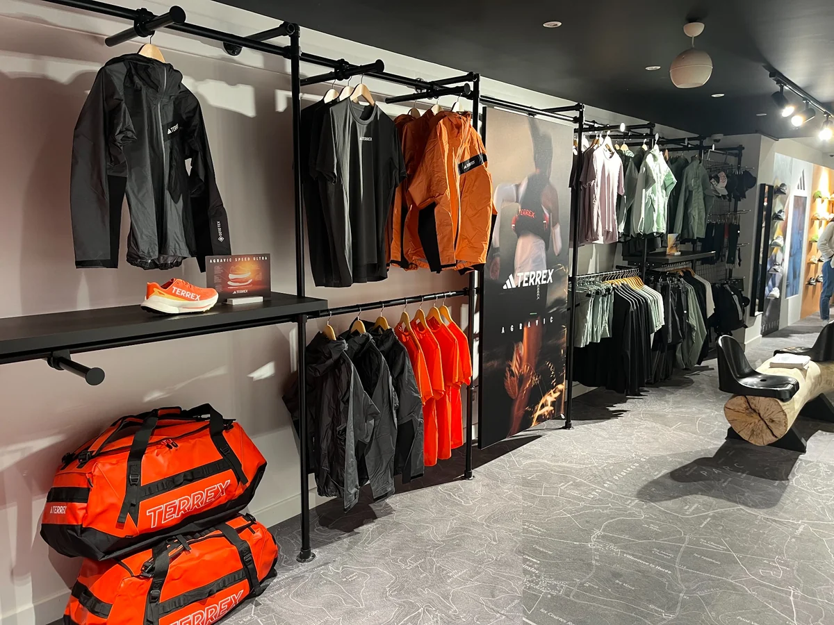 Adidas Terrex corner presentation - trail running products displayed on black racks