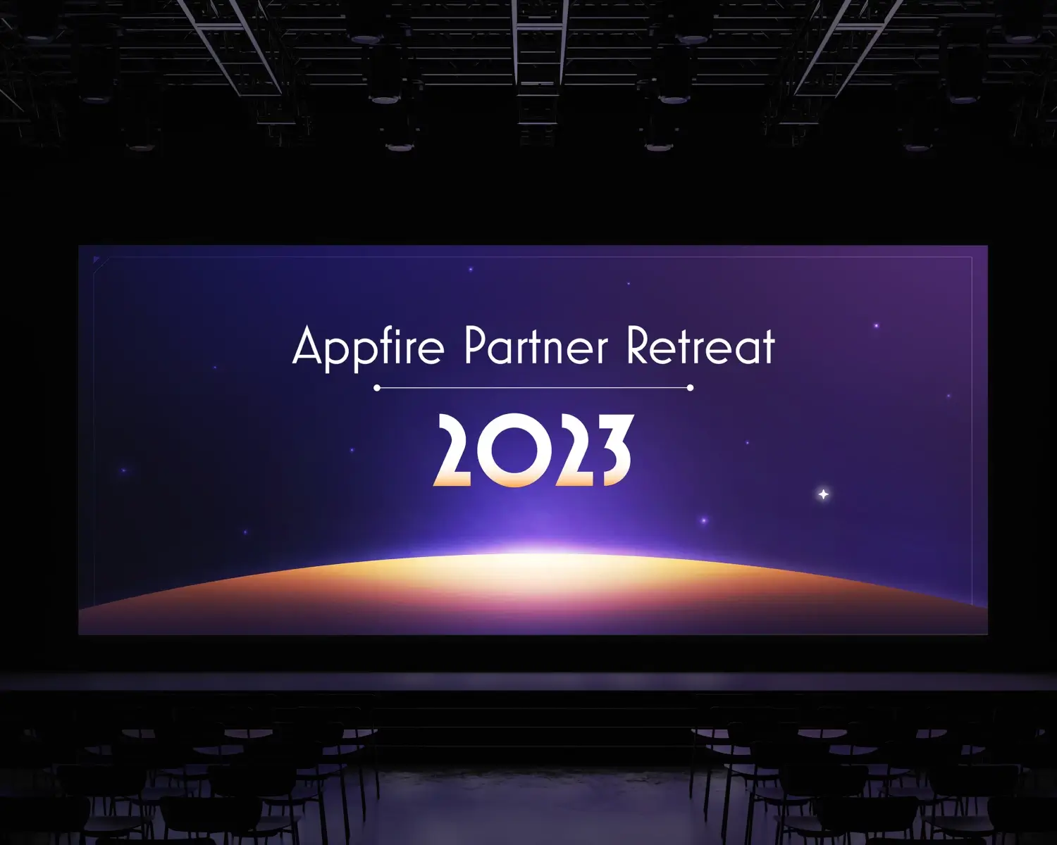 A space themed illustration shown on a large conference room screen in a dark room