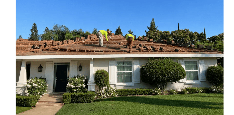 Licensed roofing crew performing tile roof maintenance for a Central Valley homeowner