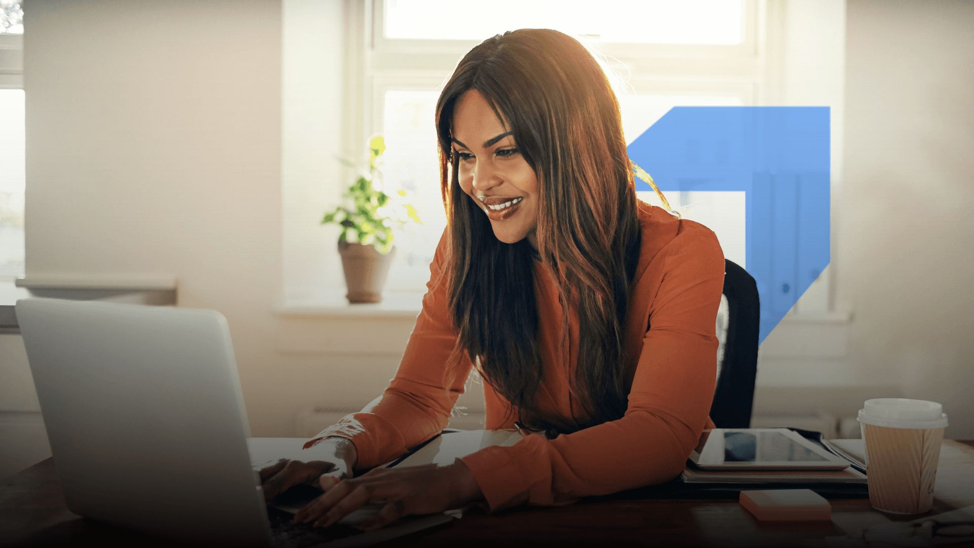 A smiling woman in an office setting