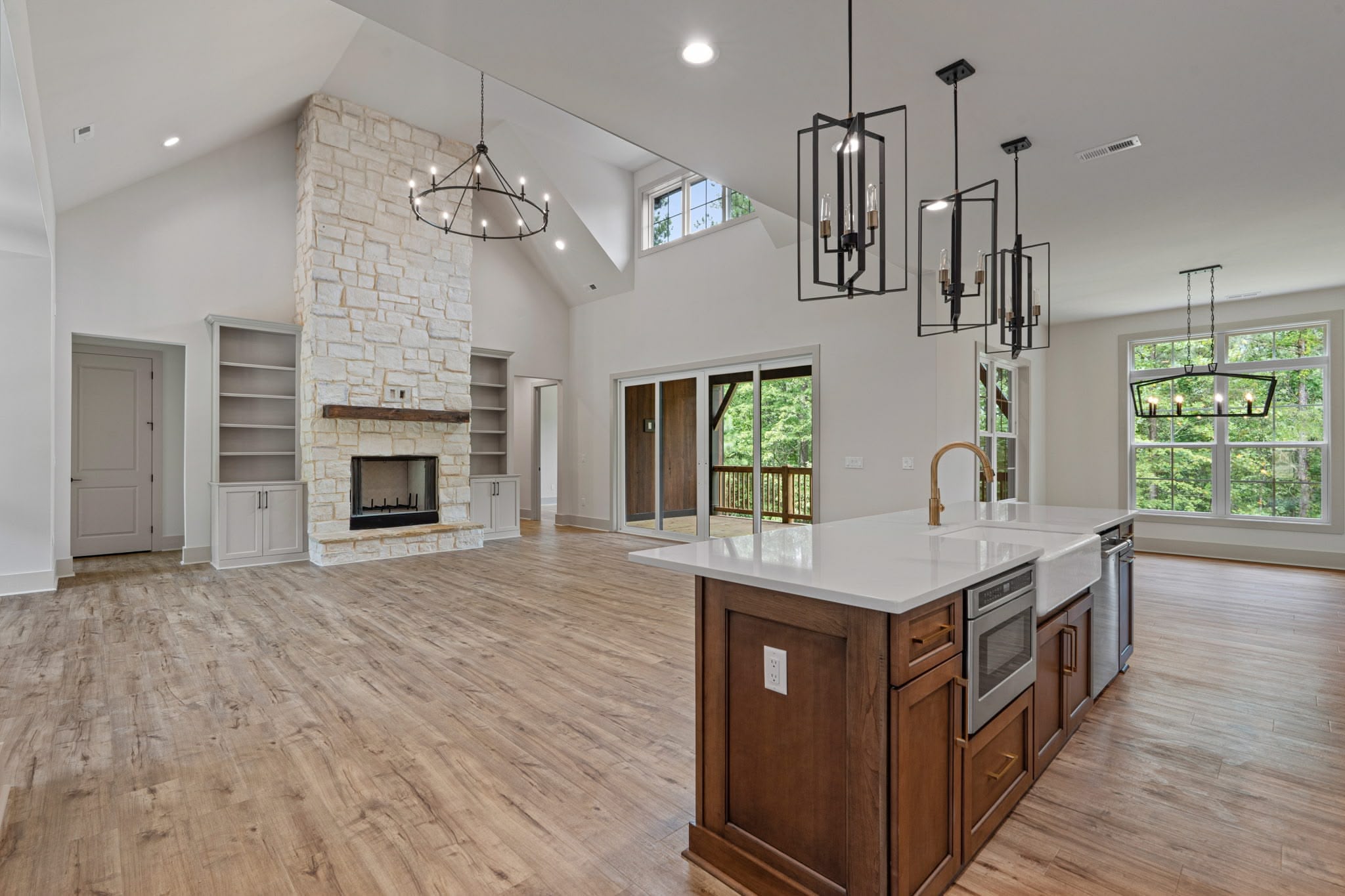 Spacious master bedroom with vaulted ceilings and hardwood floors