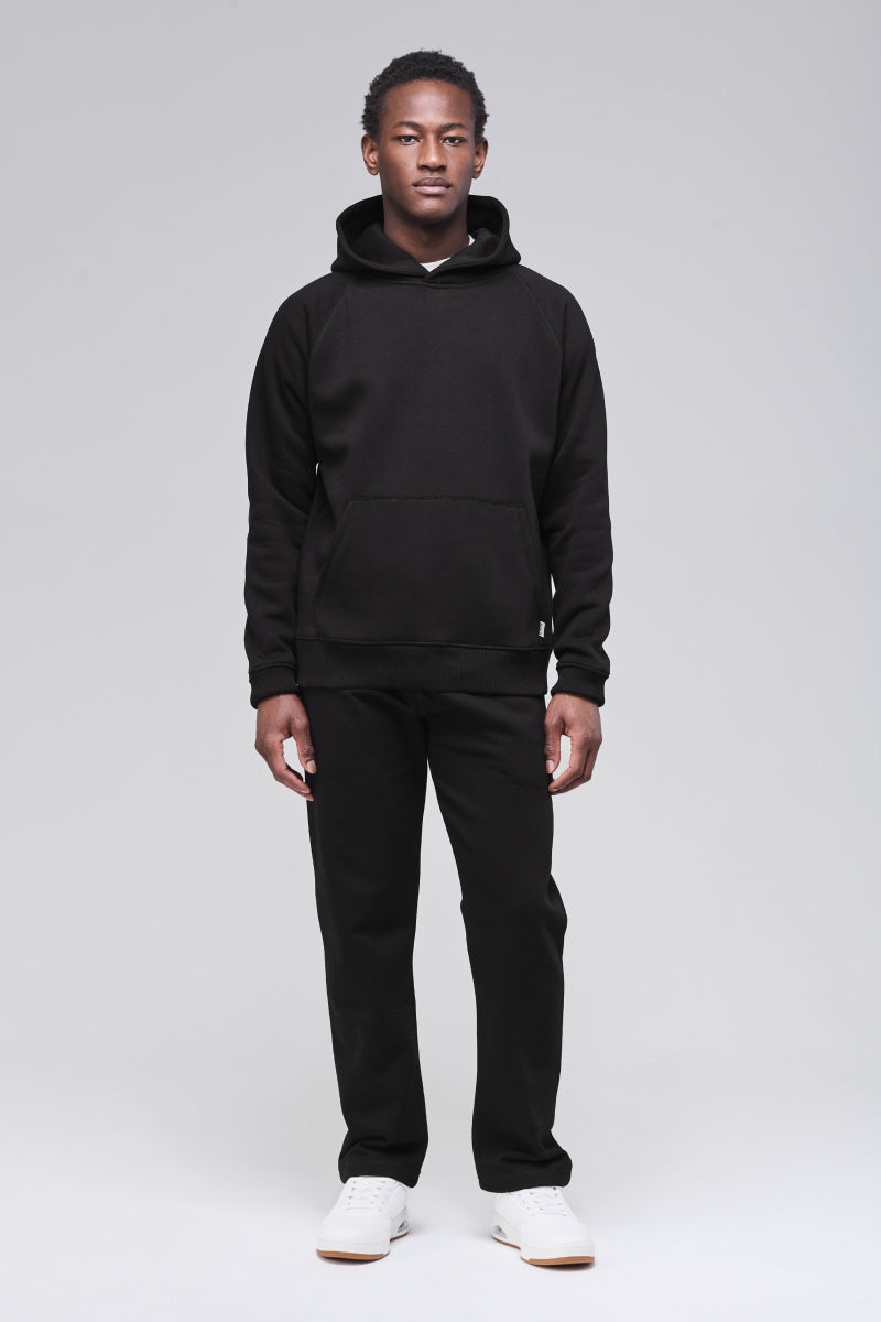 Sunday Superior Belmont Hoodie in clean black colorway, male model front view
