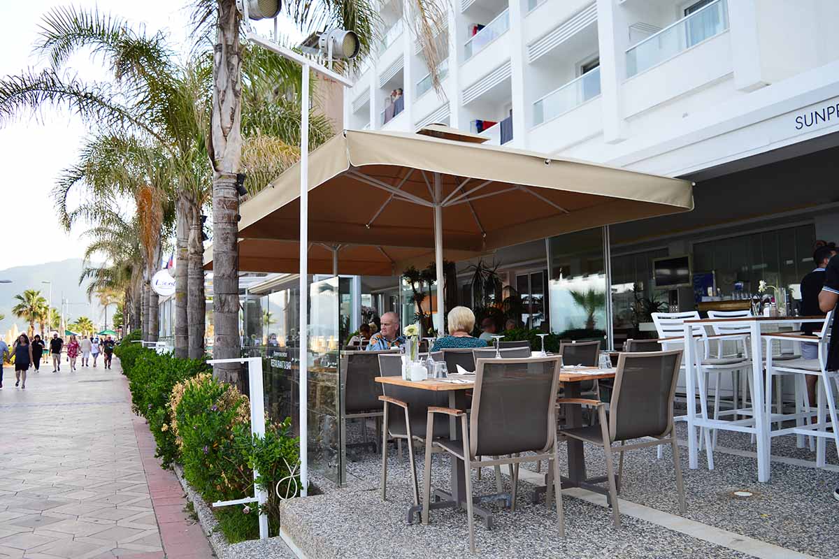 husband and wife working happily on a laptop