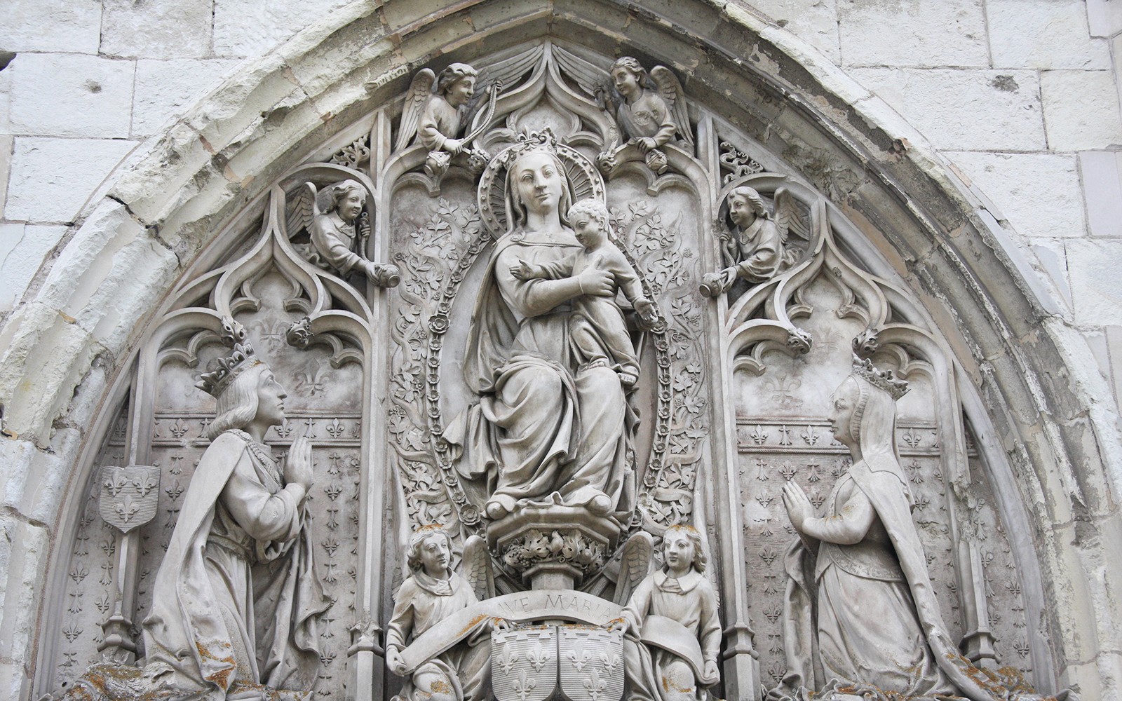Royal Amboise Castle stone relief with religious figures and intricate carvings.