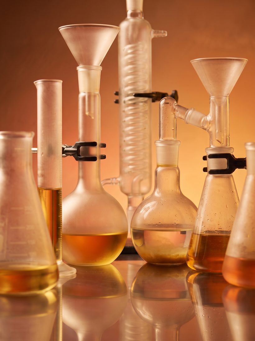Laboratory glassware on a warm amber ground