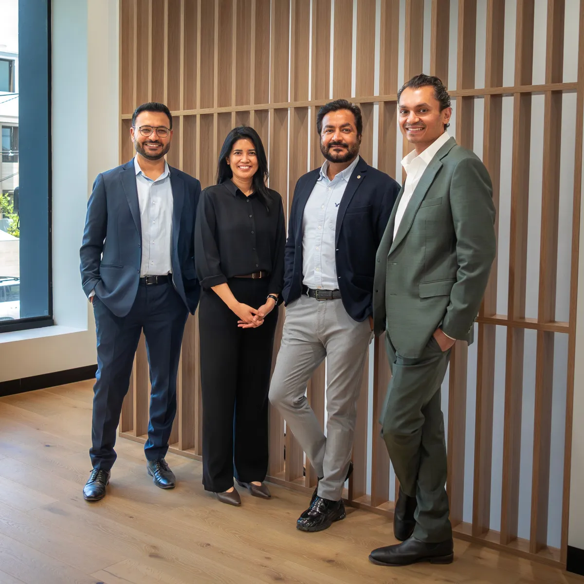 Two businessmen discussing charts on a laptop.