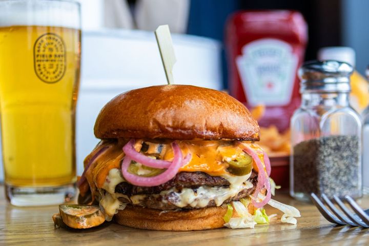 a burger with Pepper Jack Cheese, Pickled Jalapeño, and Spicy Mayo