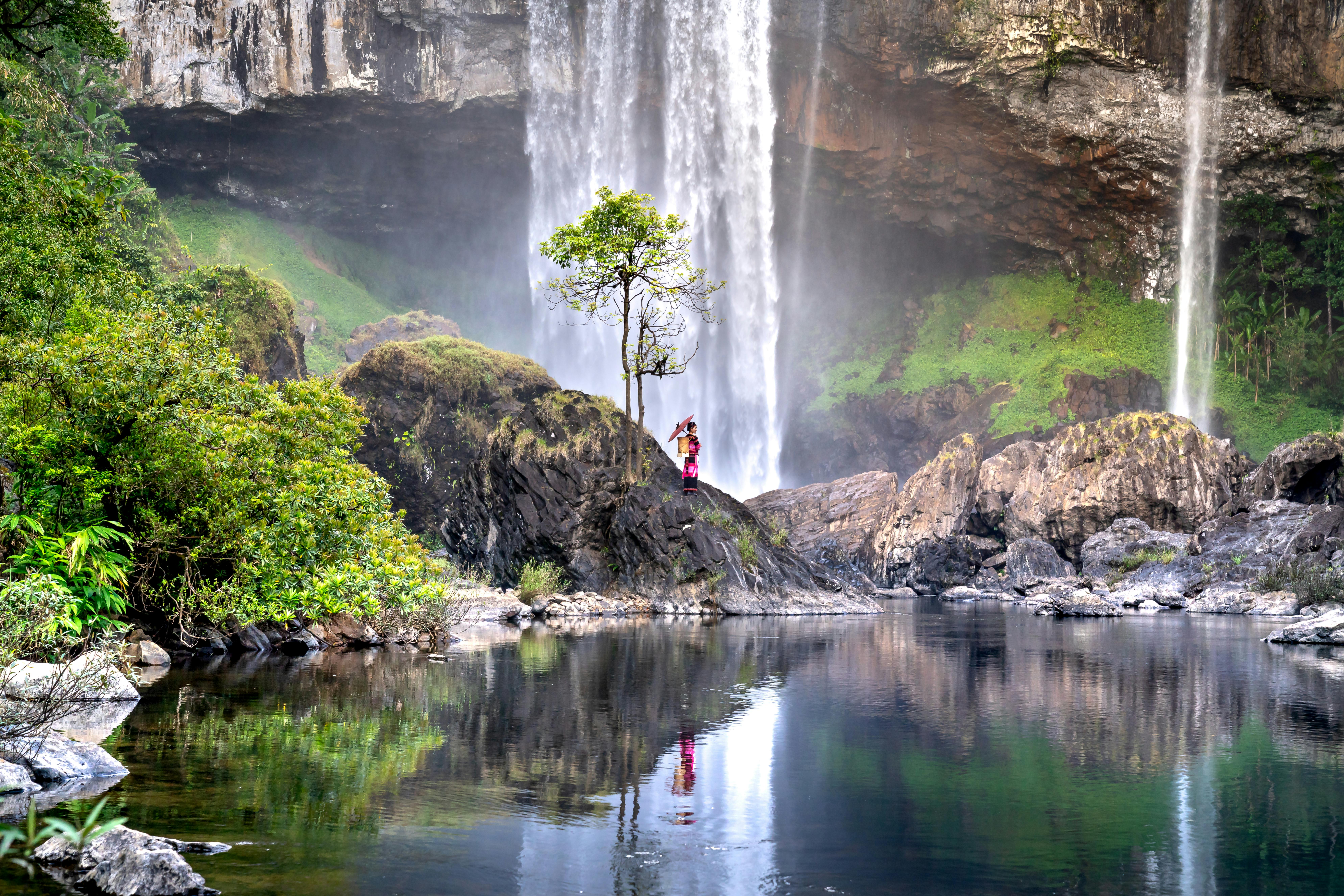 a black and white living room with a large tv