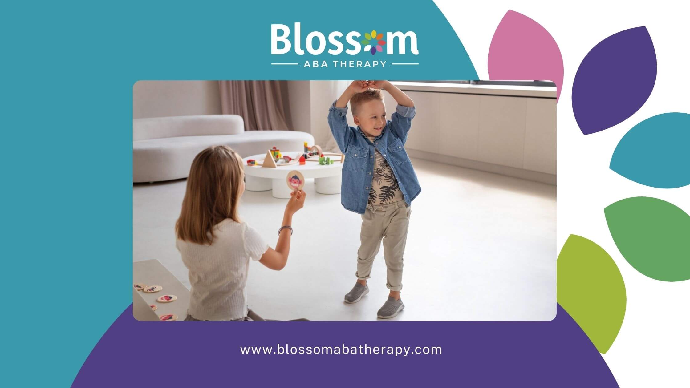 Child with autism raising arms during an ABA therapy activity while the therapist holds a picture cue.