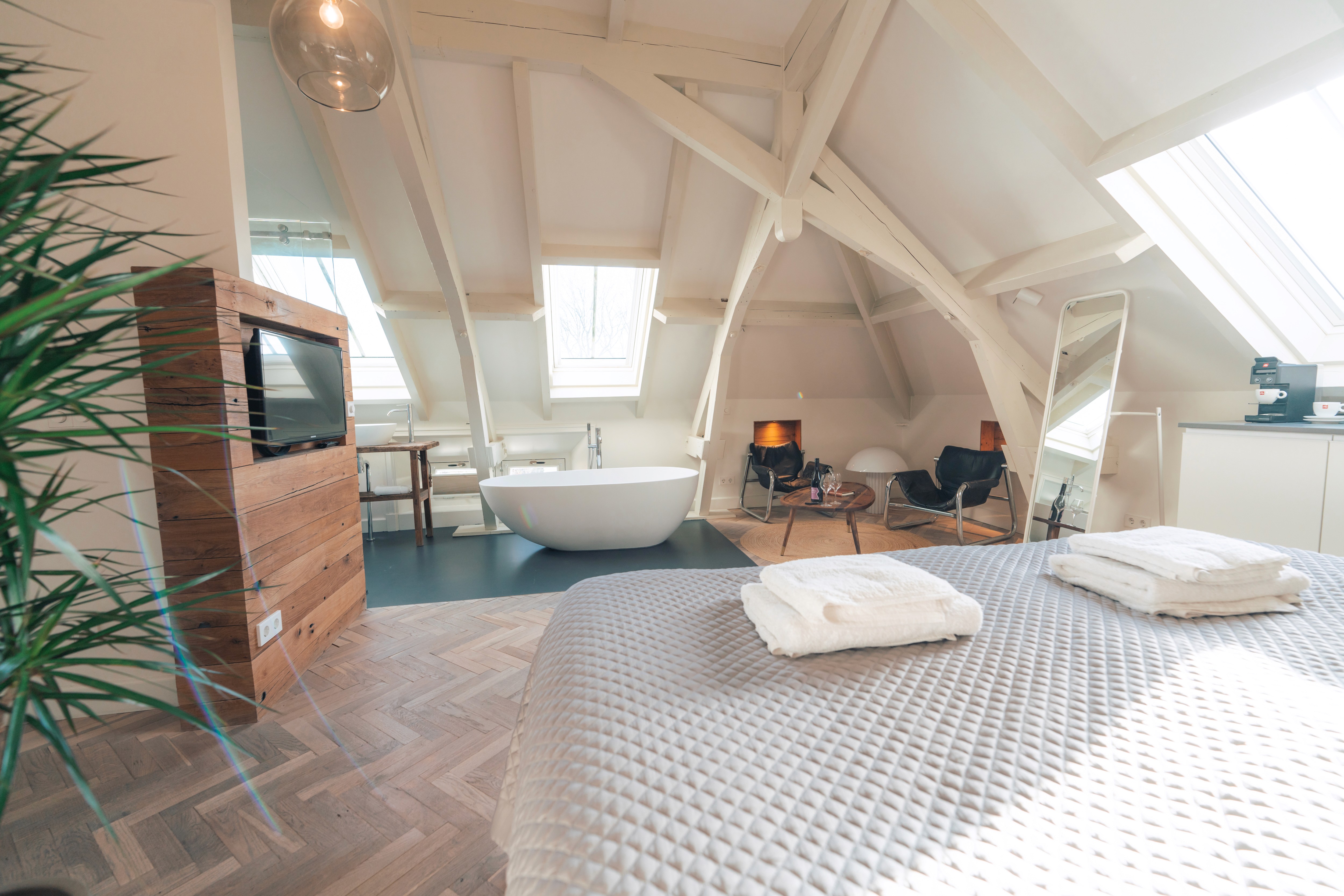 lake landscape with clear blue water, forest and mountains at the backdrop