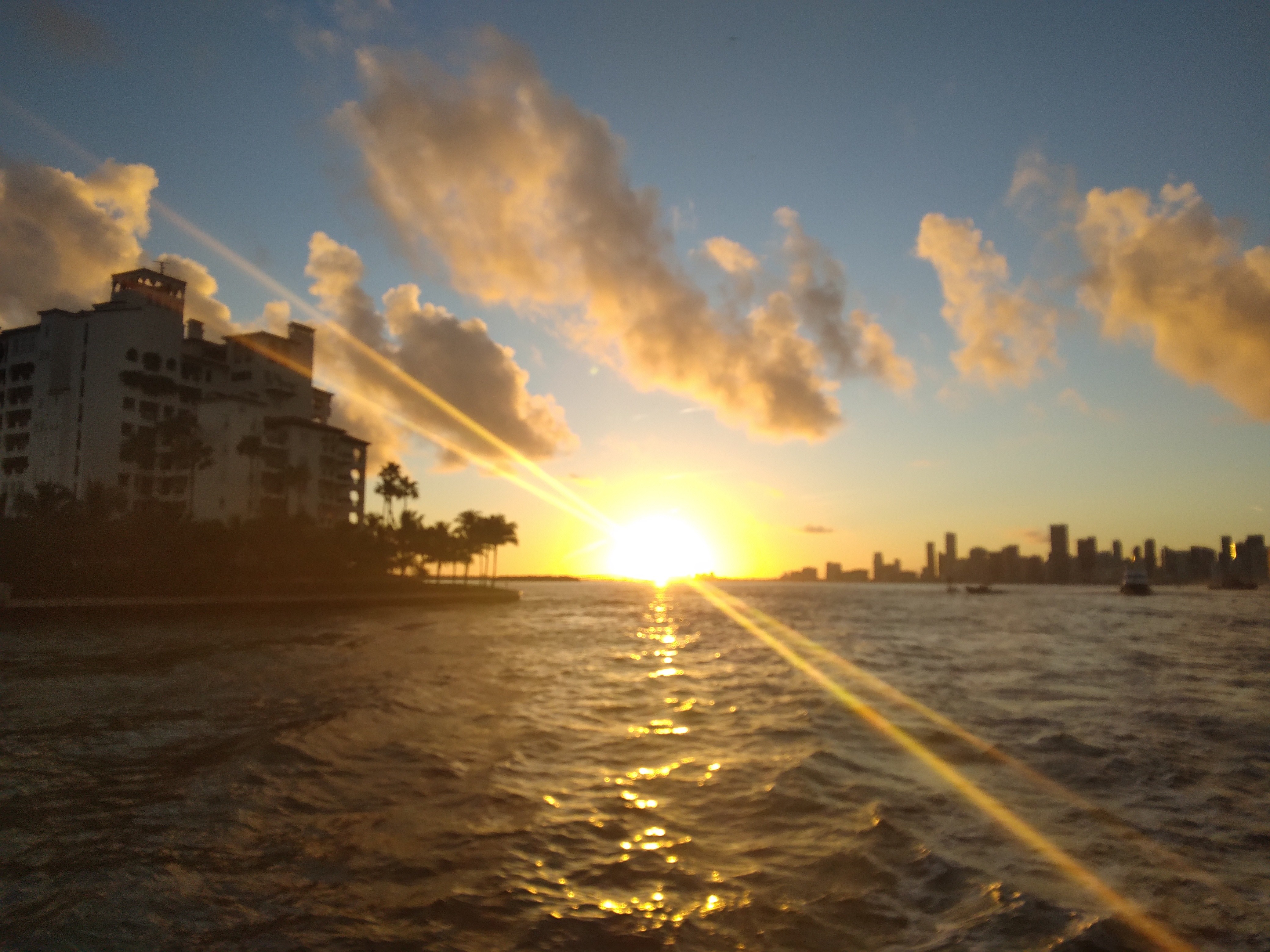 a bridge over a body of water with a statue on top