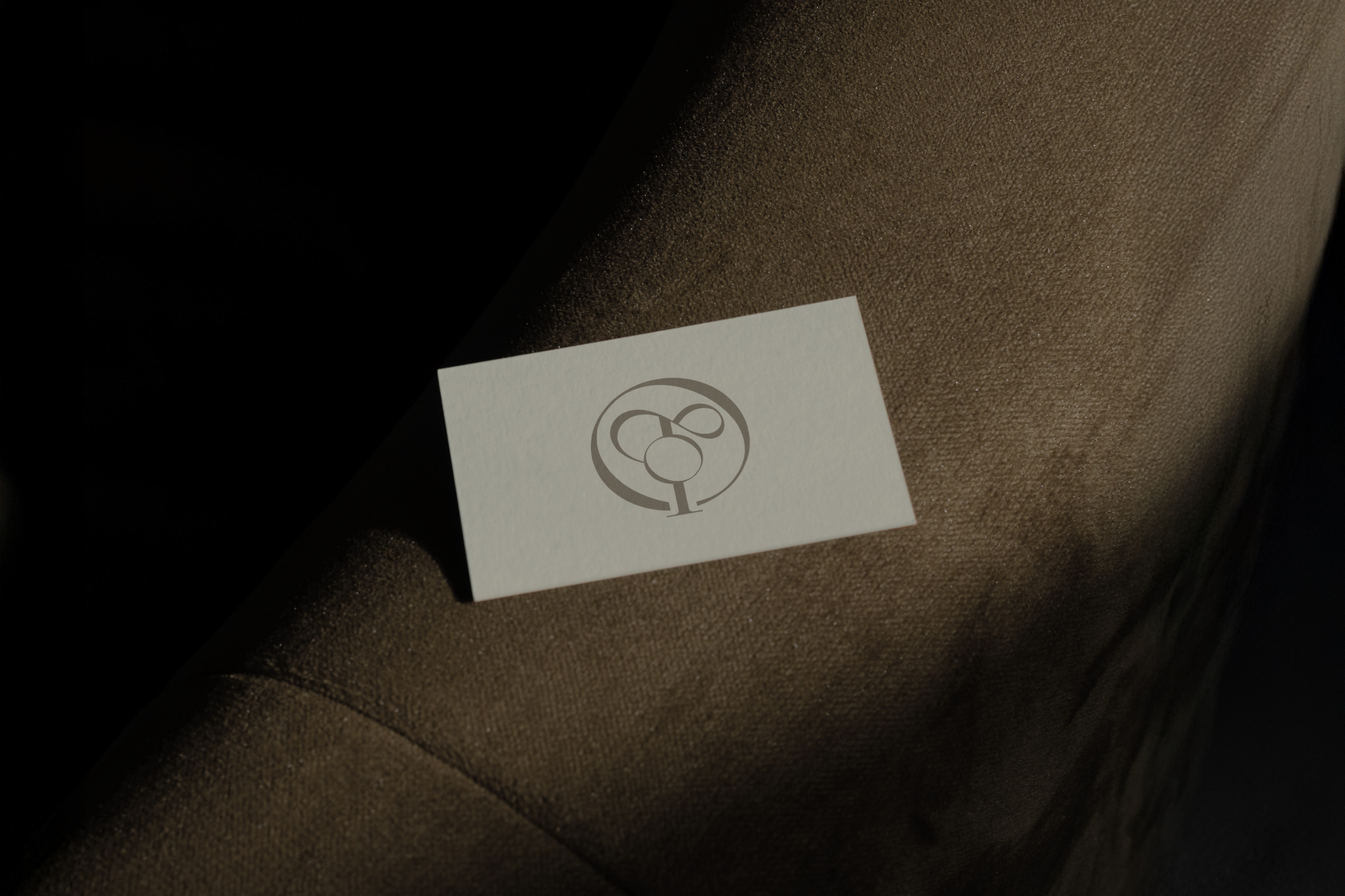 Onetone business card design – Elegant, embossed logo on a textured white card, symbolizing the brand’s premium identity in Middle Eastern fashion.