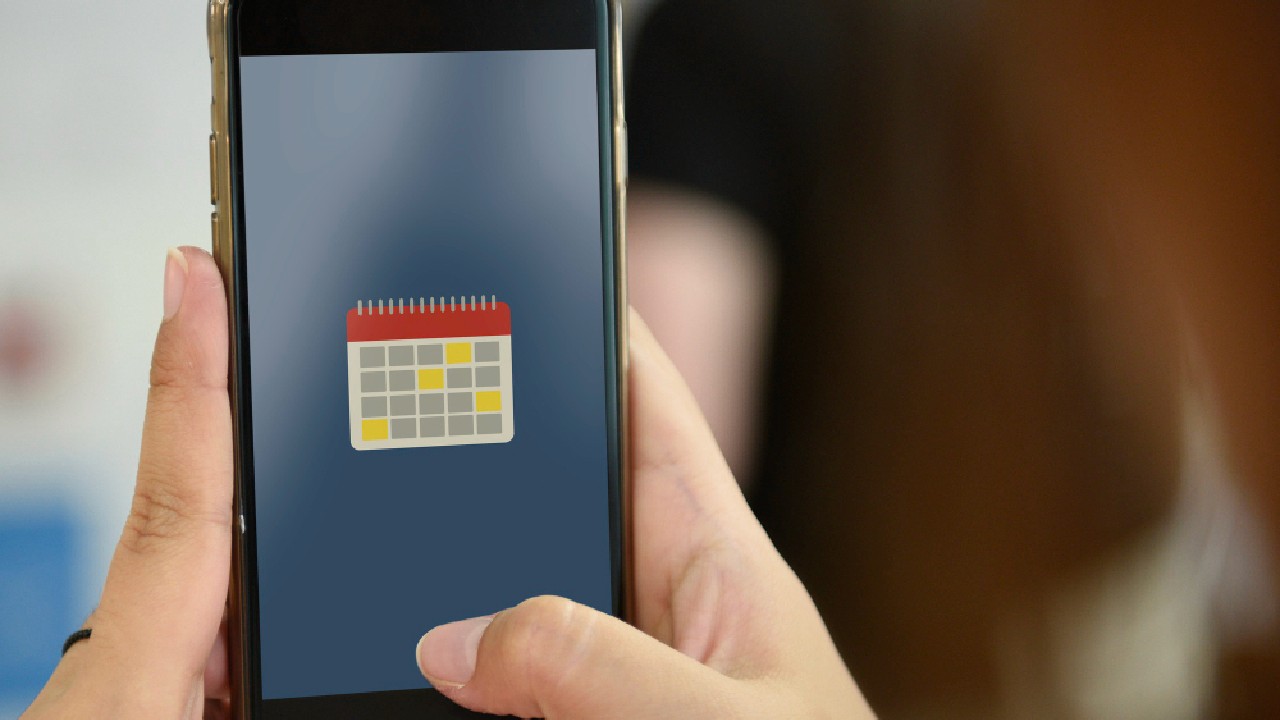 Hand holding mobile phone snap taking photo