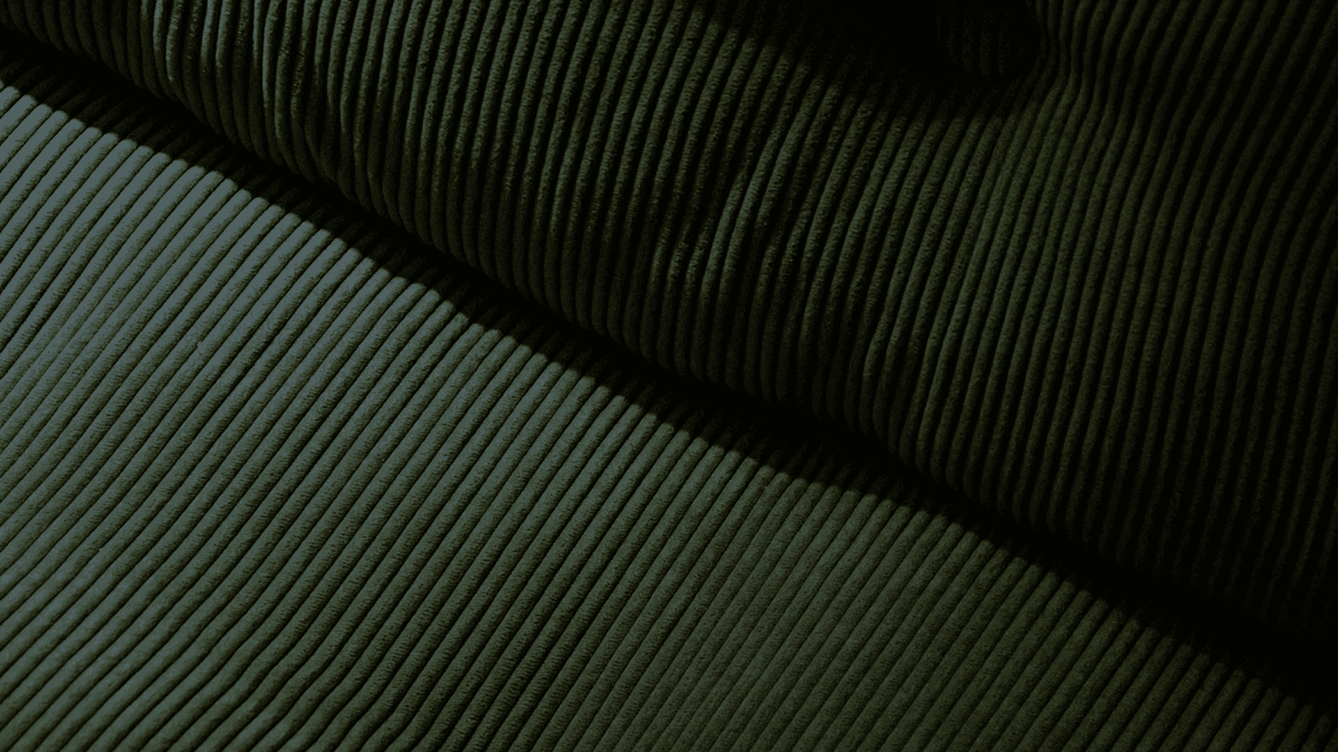 A close-up, high-angle view of deep olive green corduroy fabric, showing the rhythmic pattern of its thick, parallel ridges and soft texture.