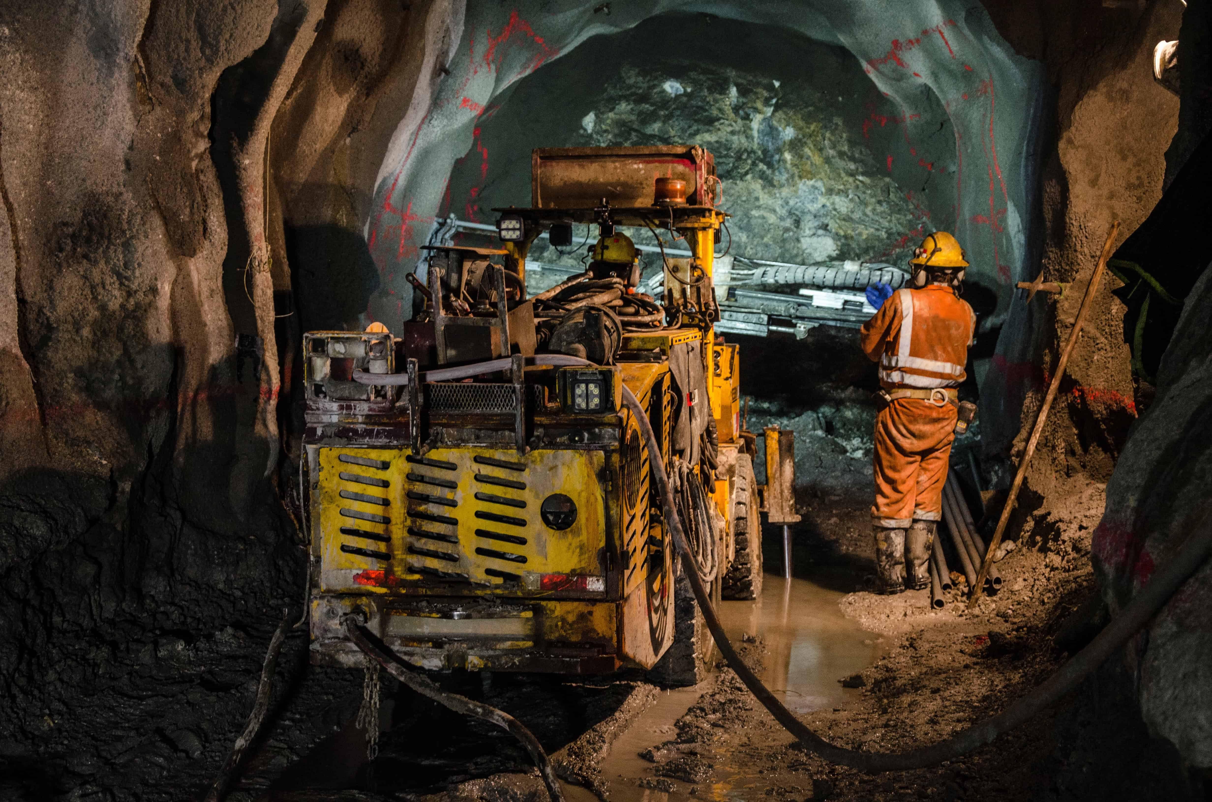 Underground mining operations with heavy machinery where risk of mine collapse and being trapped is high