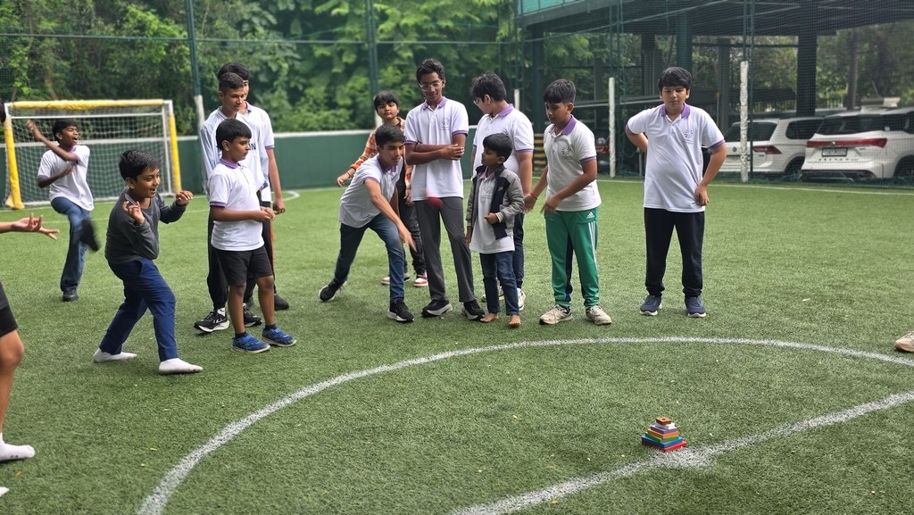 red and black concrete building under white clouds during daytime