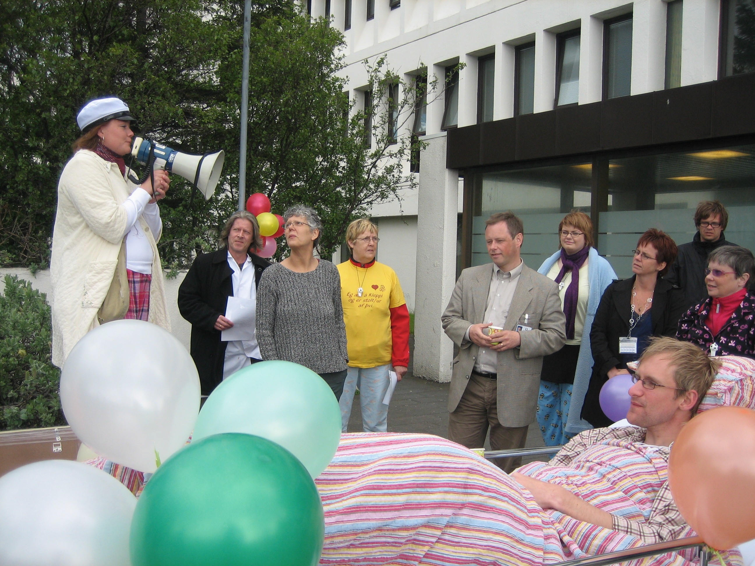 Scientist using a multi-channel pipette to transfer liquid samples in a lab, wearing gloves and surrounded by lab equipment.