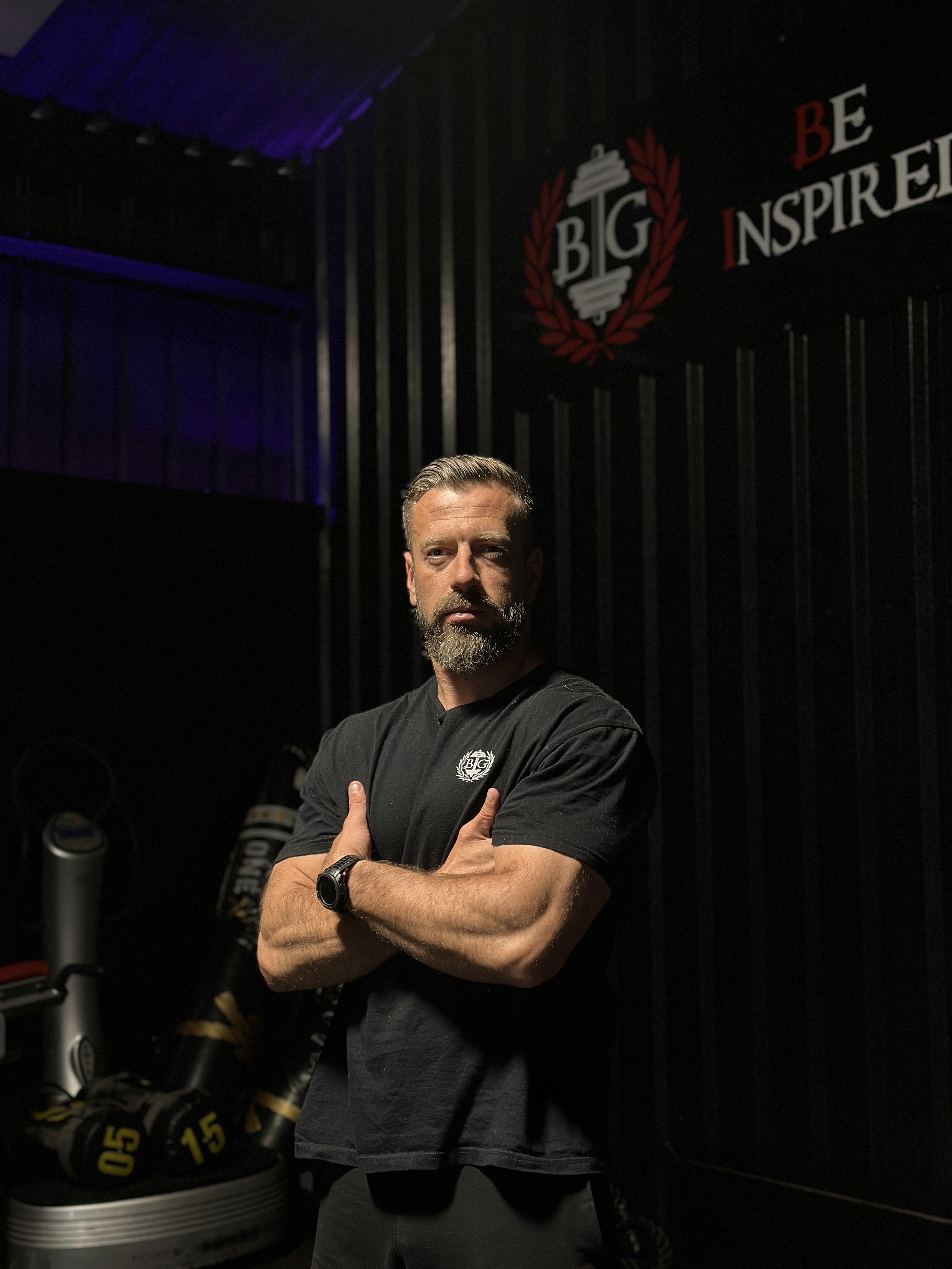 Man doing shoulder workout in the gym