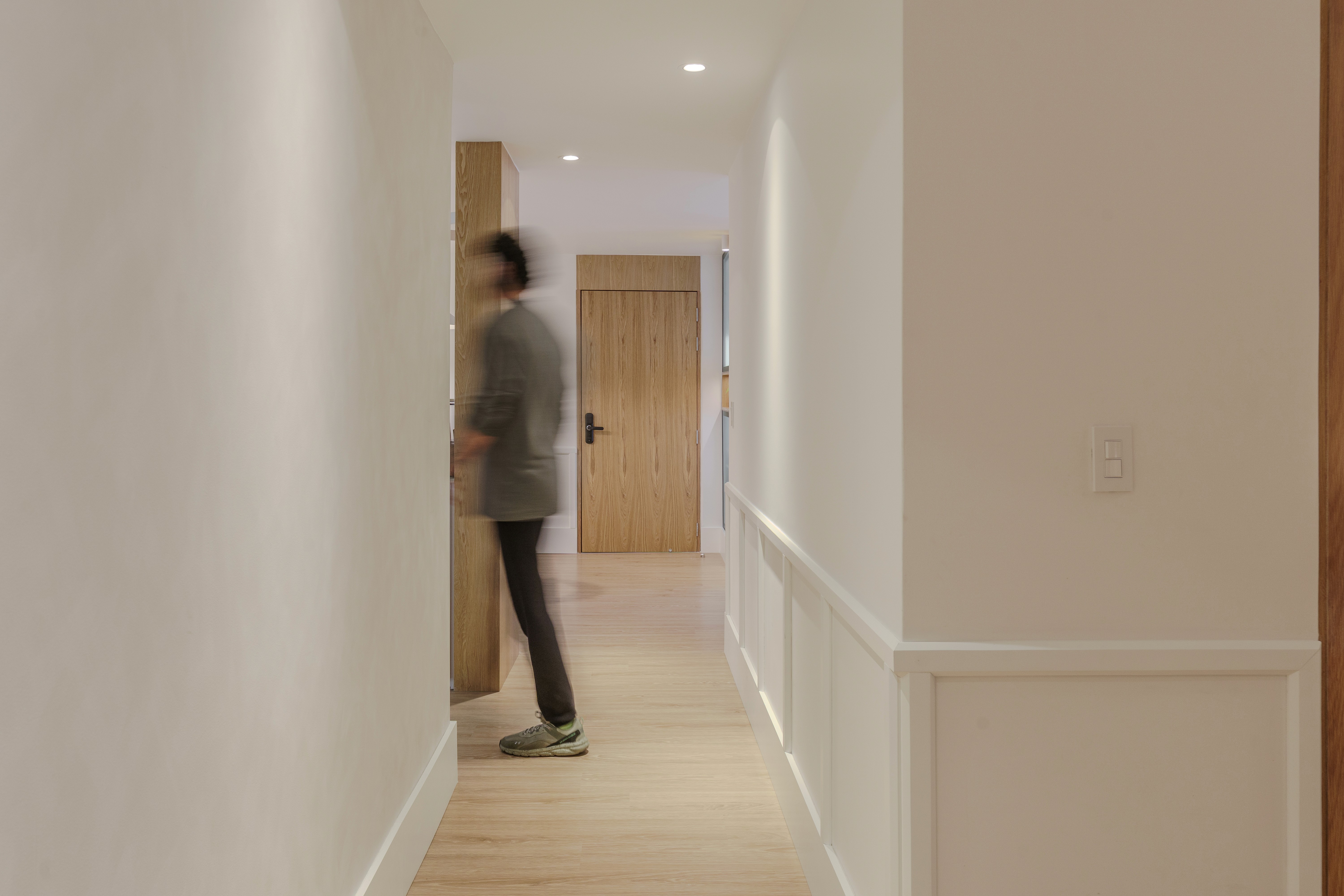 Double-height interior with flowing sculptural forms and warm raking light