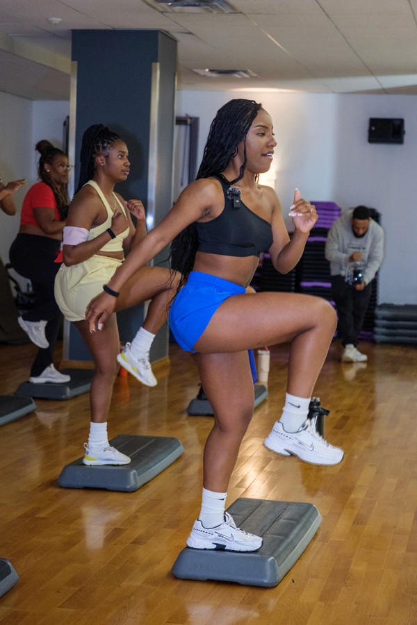 Fitness participants exercising together in a class