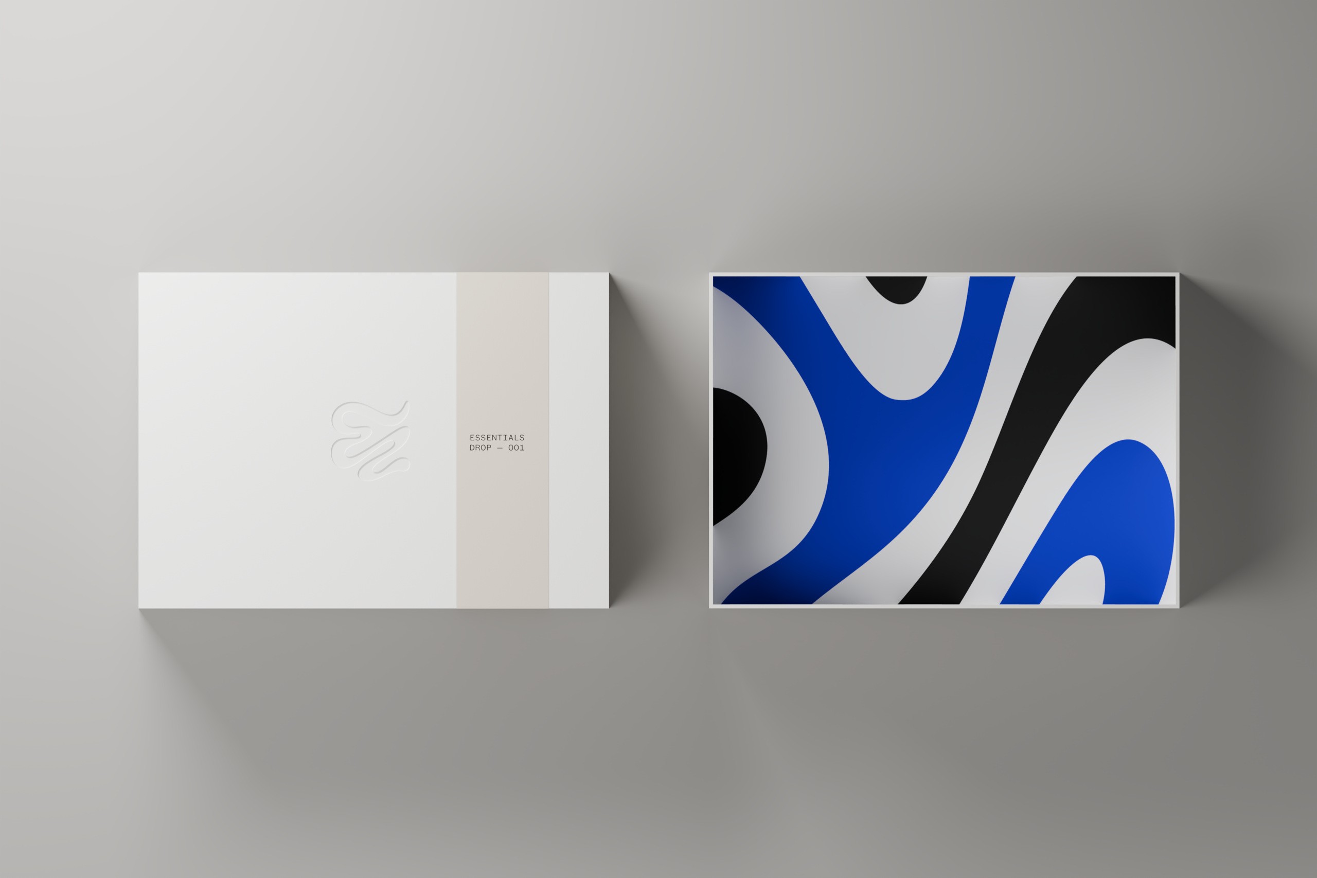 Top view of BLNKK packaging with embossed lid and blue, black and white interior