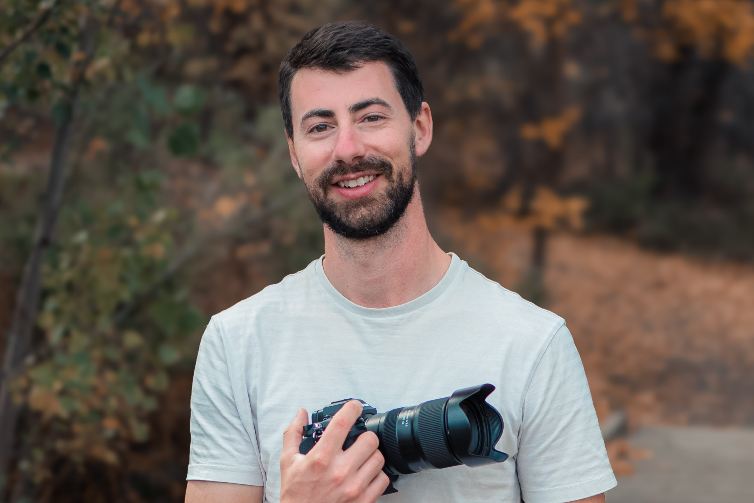 a man wearing glasses and a black shirt