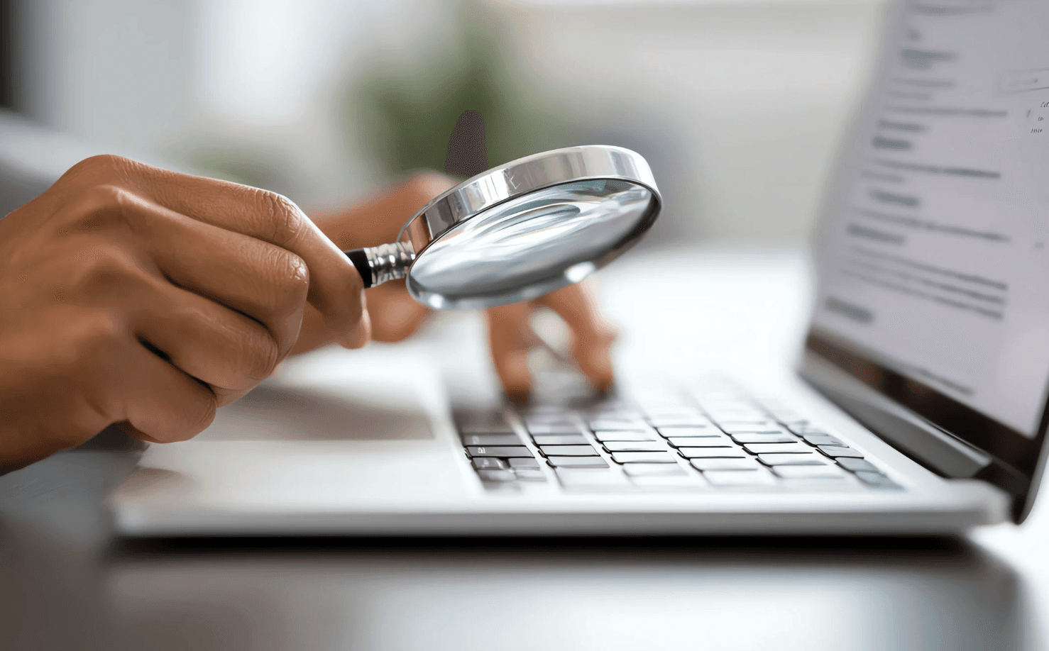 Amazon seller analyzing campaigns with magnifying glass to identify and eliminate keyword overlap in PPC advertising